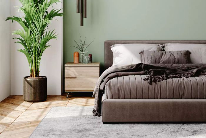 A contemporary bedroom featuring modern furniture in soft pastel hues.