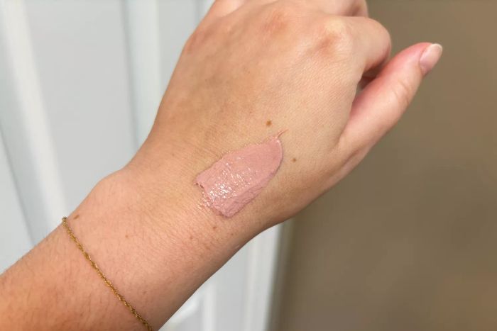 A dollop of Kinfield Sunglow SPF 35 on the back of a hand