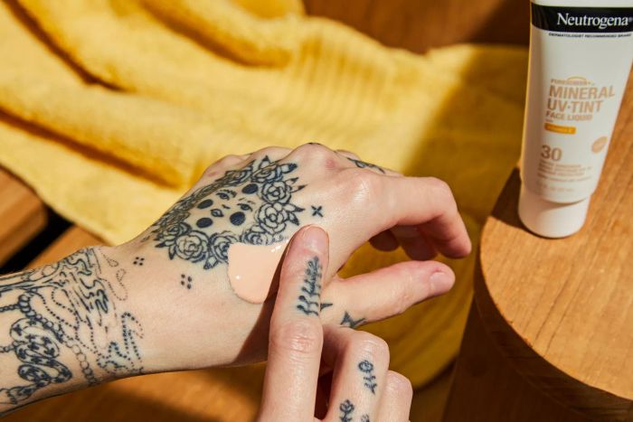 Neutrogena Purescreen+ Mineral UV Tint Face Liquid Sunscreen being applied to the back of a hand
