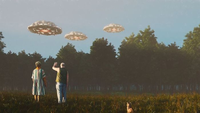 An elderly couple greeting UFOs from a distance.