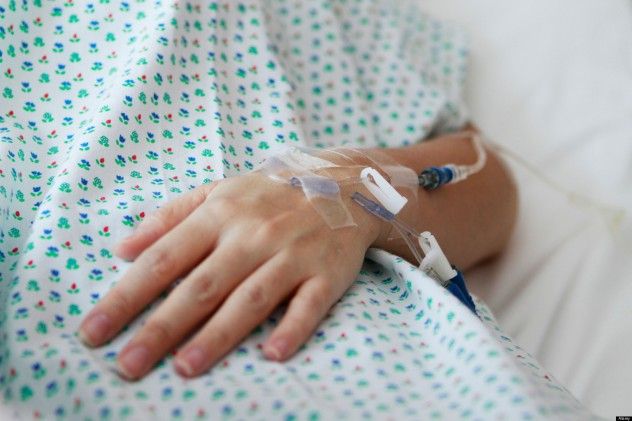 A close-up shot of a patient's hand receiving an intravenous drip. (Captured with shallow depth of field)