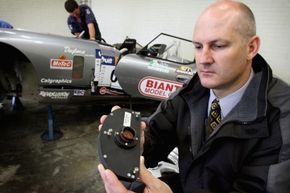 Black boxes aren’t just for airplanes: The device shown here was taken from a race car involved in a crash in Australia in 2006.