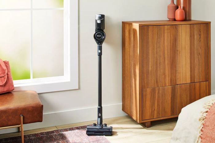 Levoit VortexIQ 40 Cordless Stick Vacuum displayed against a wall