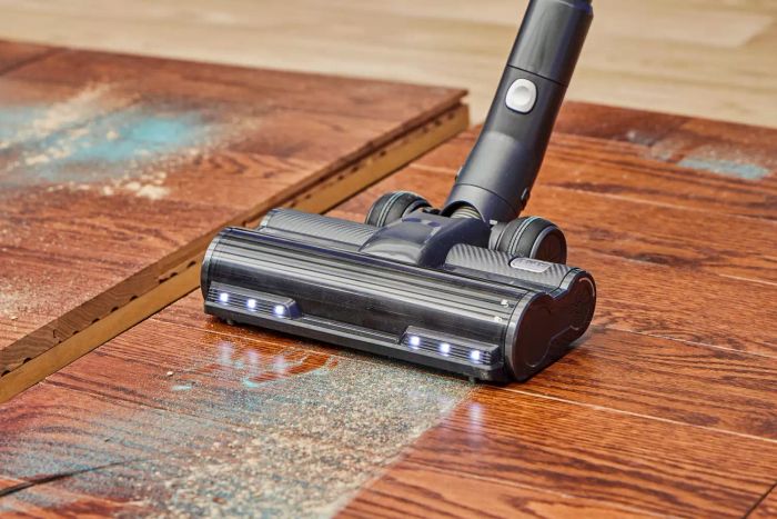 Close-up of the Levoit VortexIQ 40 Cordless Stick Vacuum cleaning a wooden surface