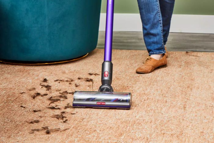 A close-up view of the Dyson Gen5detect Cordless HEPA Vacuum placed on a soiled carpet.