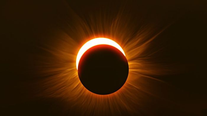 An image of the moon obscuring the sun during a solar eclipse.