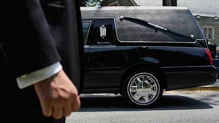 A hearse with the signature S-shaped bars replacing the usual back windows.