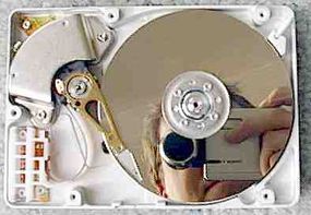 The inside of a hard disk drive.