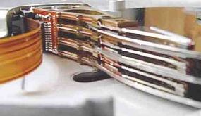Three disk platters inside a hard disk drive.