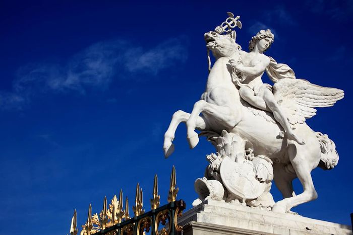 A sculpture of the god Mercury riding Pegasus in Tuileries Garden.