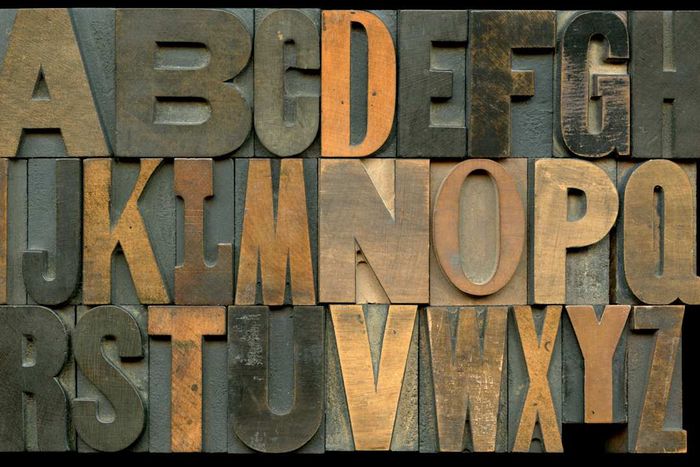 The alphabet composed of wooden letter blocks