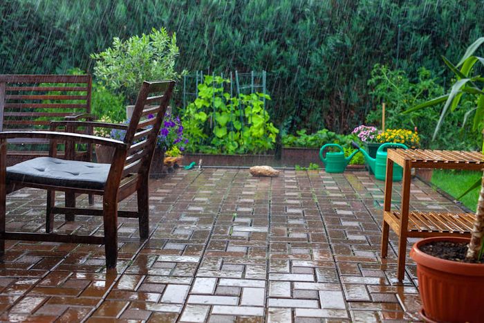Heavy rainfall in the garden and backyard of a private home.
