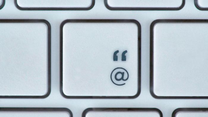 The at symbol and quotation mark, as seen on a computer key.