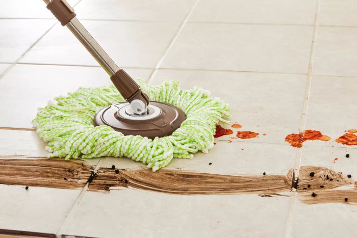 The Oshang Spin Mop and Bucket effectively removes stains from tile floors.
