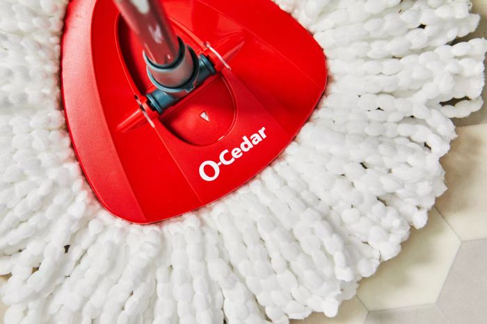 Close-up of the O-Cedar EasyWring Spin Mop and Bucket System displayed on a tile floor