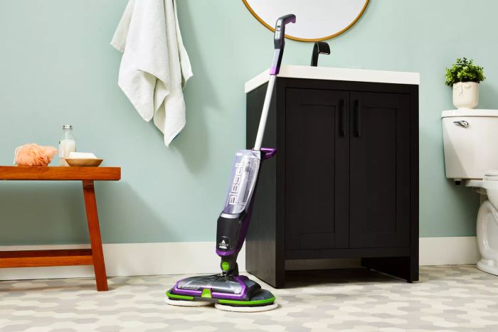 The Bissell SpinWave Cordless Pet Hard Floor Spin Mop displayed in a bathroom