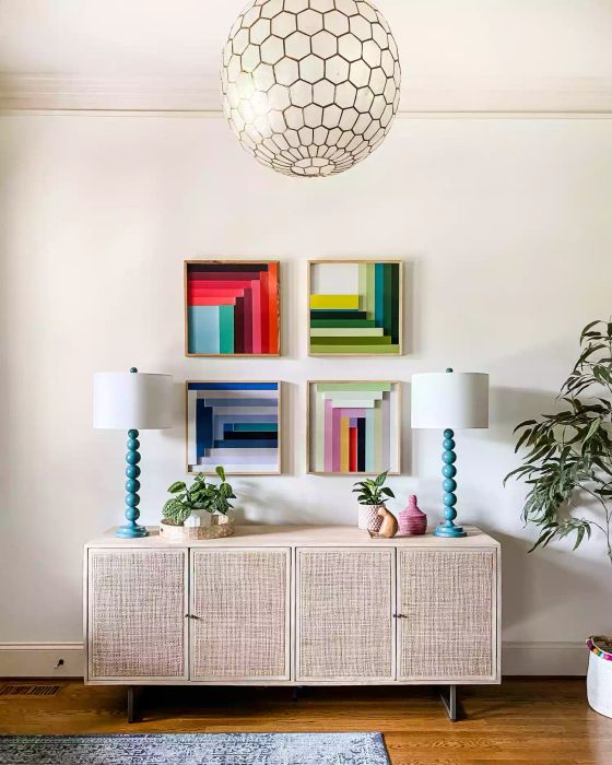 Entryway Table Styling Ideas: Colorful Artwork and a Cane Console Table