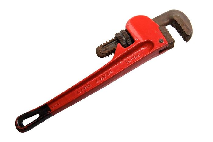 A pipe wrench is shown in the image.