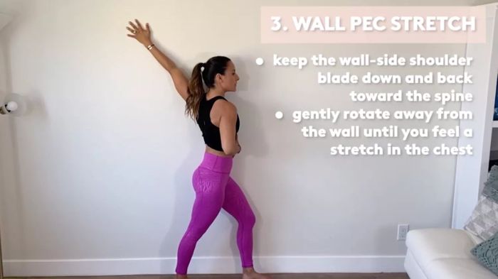Physical Therapist Demonstrating Stretches for Upper Back Pain: Wall pec stretch for the upper back