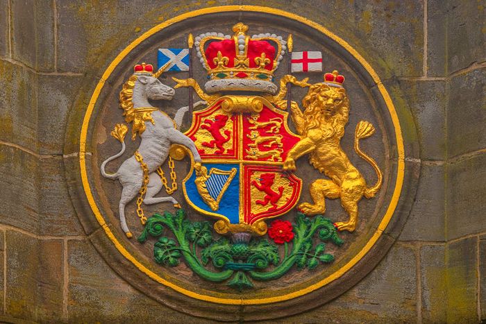 The coat of arms displayed on Edinburgh's Mercat Cross, featuring a lion and a chained unicorn.