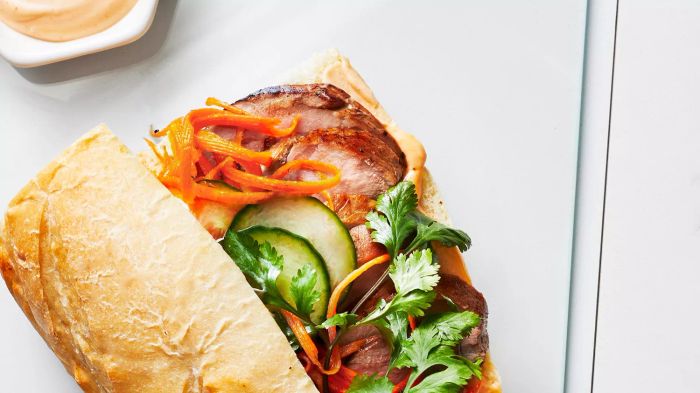 A quick and easy pork banh mi sandwich that's bursting with sweet and tangy flavors, thanks to a fast marinade and roast. Skip the cilantro if it's not your thing.
