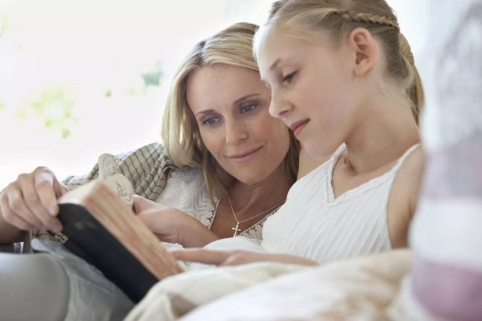 Mother and daughter reading together