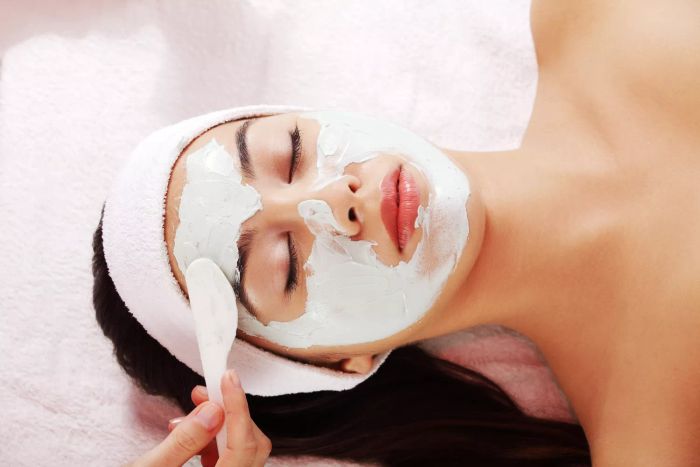 Woman receiving a face mask treatment