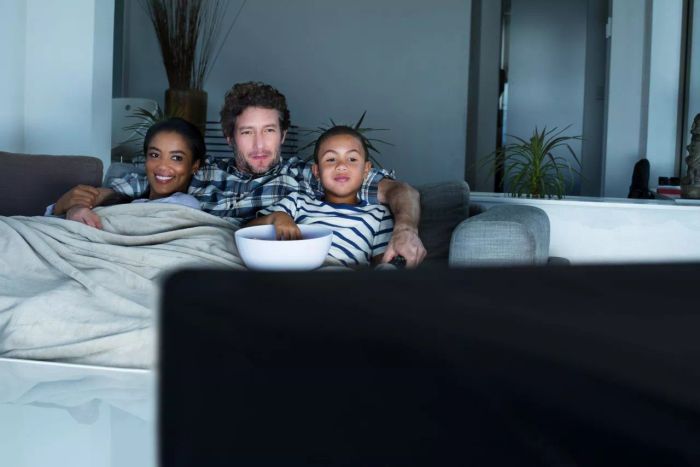 Image of a family enjoying TV together