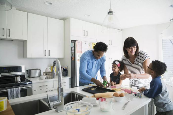 Family baking cookies in the kitchen