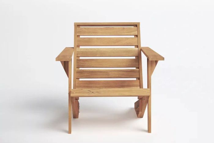 The Joss & Main Ursa Acacia Outdoor Adirondack Chair combines rustic charm with functionality, featuring a robust acacia wood structure that is perfect for outdoor relaxation while maintaining a refined, low-sitting profile.