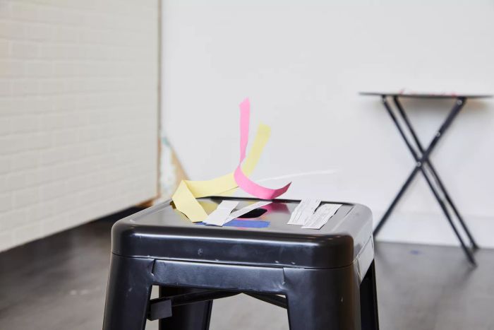 Paper being blown off the stool