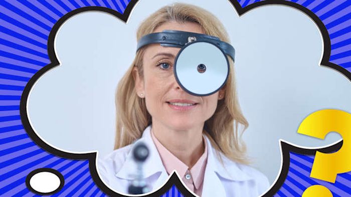 A doctor equipped with the latest in medical tools: a head mirror.