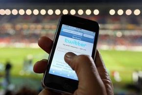 The Twitter website is accessible on a mobile device in Newcastle, Australia.