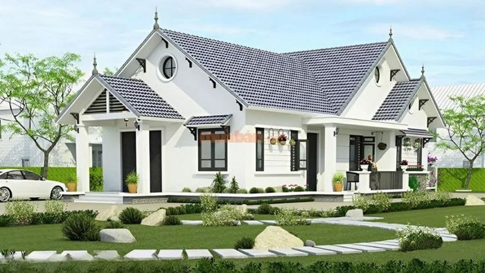 Nhà vườn 2 tầng mái thái hiện đại với lối đi được thiết kế tinh tế bằng đá.