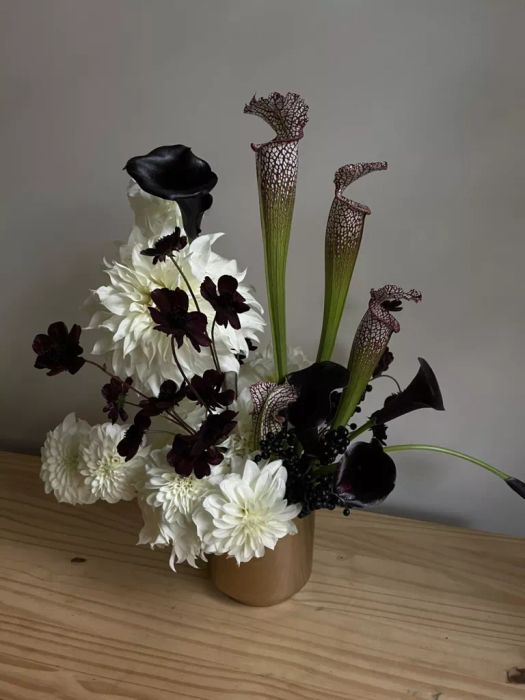 Flower Arrangement Featuring Black and White Blooms