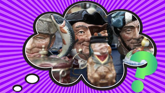 Toby mugs displayed at a market stall.