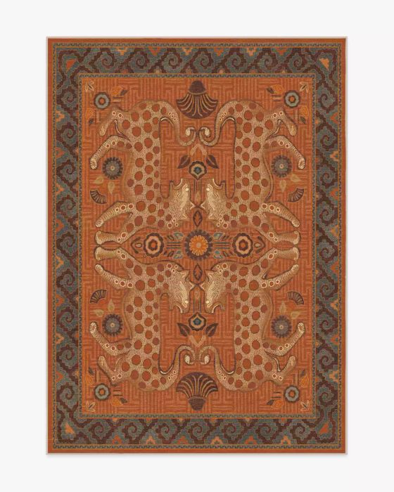 A terracotta orange rug adorned with an animal print pattern.