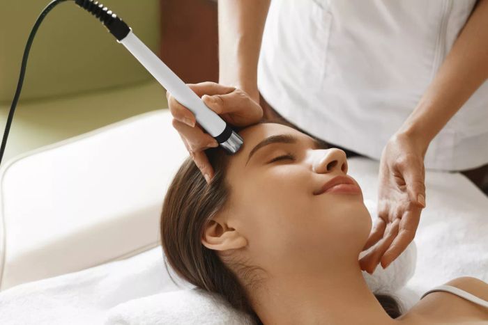 Microdermabrasion Treatment at a Beauty Salon. Woman Enjoying a Skin Refreshing Procedure at a Cosmetology Center