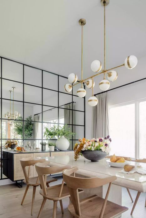 Dining room featuring a mirrored wall
