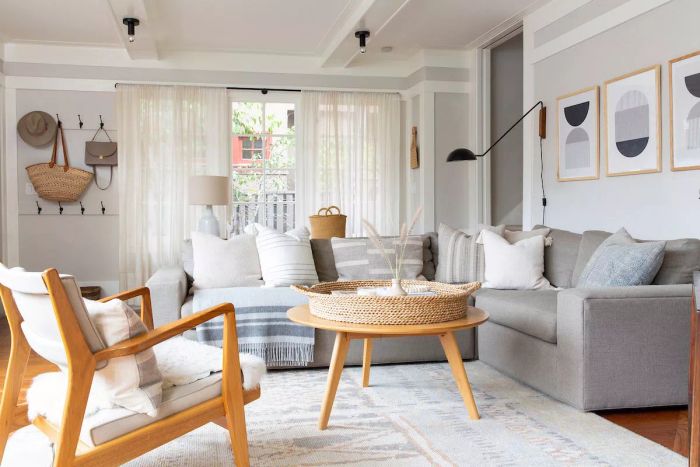 A peaceful living room featuring a wooden coffee table and chair: Shira Gill