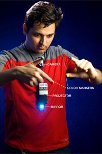 Mistry showcases the gestures used with SixthSense.