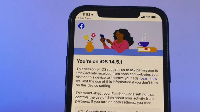 A privacy notice is displayed on an iPhone 12.