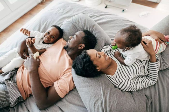 family lounging on the bed