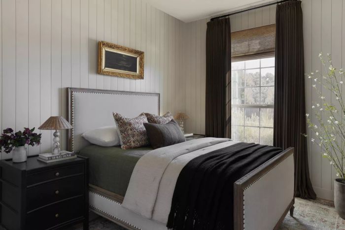 Minimal bedroom with nightstand and bed and drapes