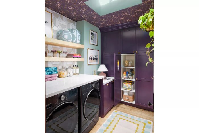 This laundry lounge area showcases a blend of patterns and vibrant colors