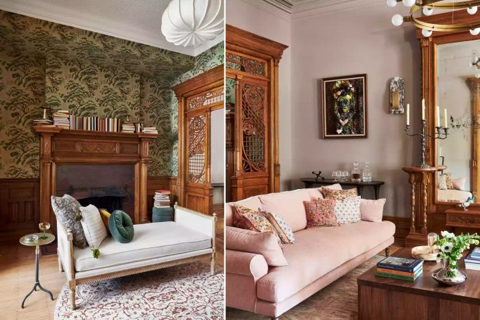 A living room featuring a pink sofa with wooden accents and a lounge area with a gray lounge chair positioned near a fireplace