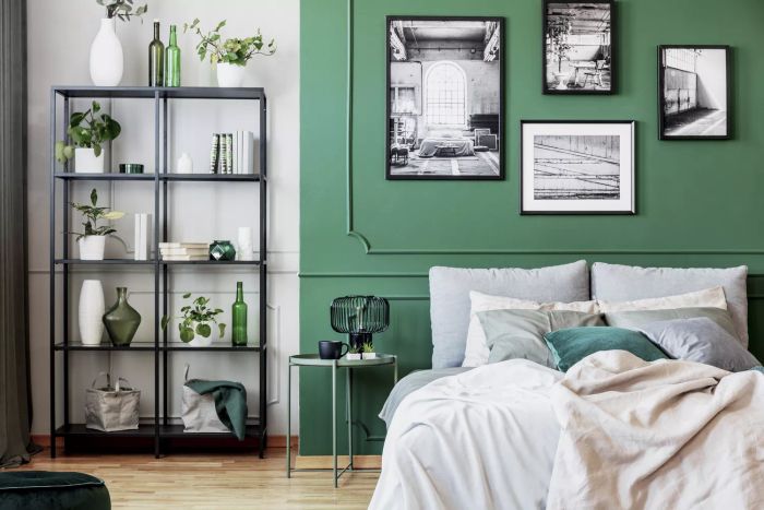 A bedroom painted in shades of green