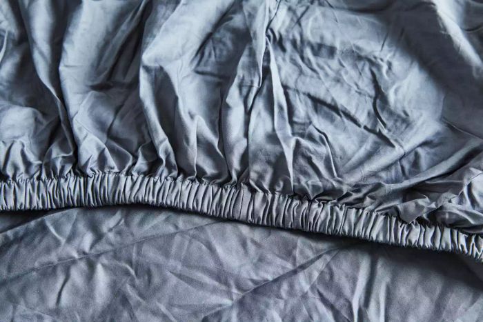 A close-up view of the seam on the Sijo Home Organic Percale Cotton CrispCool Sheet Set