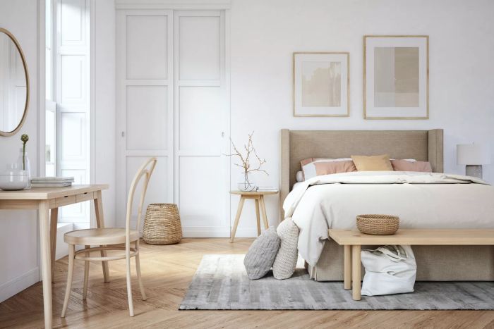A bedroom featuring white walls