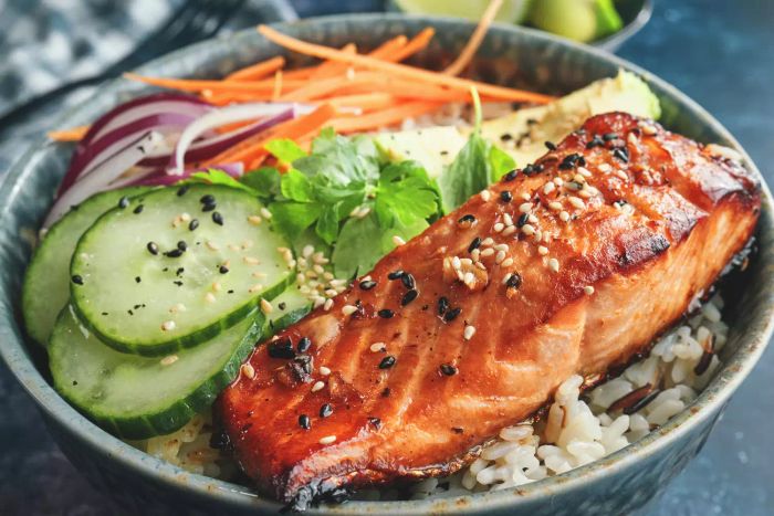 Spicy Salmon Bowl with Rice, Carrots, Cucumber, and Avocado